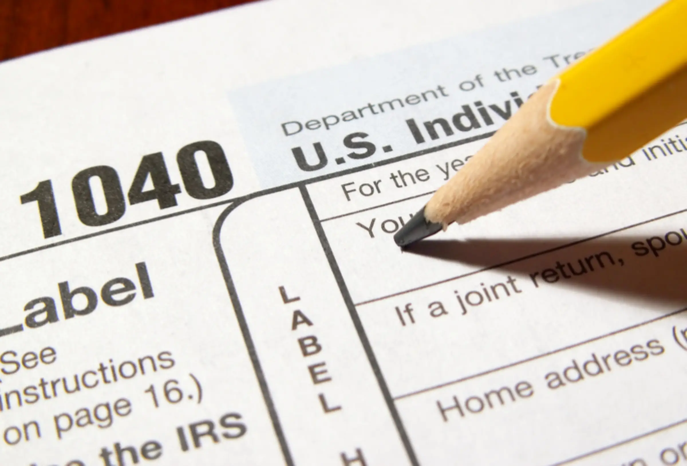 A pencil is on top of the irs form.